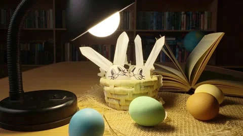 Diy easter bunny rabbits in dark room at lamp. Stock Footage 172523897
