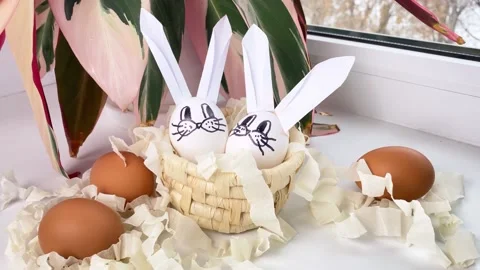 Diy easter bunny rabbits on windowsill. Stock Footage 172434601