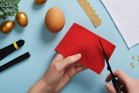 DIY Easter Egg King. Step-by-step instructions. Step 3. From the red felt cut ou Stock Photos