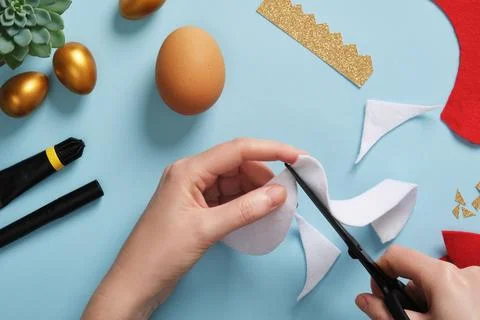 DIY Easter Egg King. Step-by-step instructions. Step 4. From white felt or fur,  Stock Photos