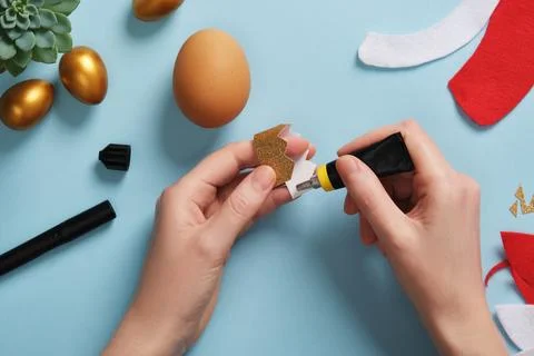 DIY Easter Egg King. Step-by-step instructions. Step 5. Glue the golden crown to Stock Photos