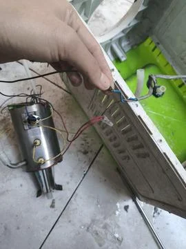 DIY electronics repair, fixing broken home appliance wiring and components. Fotos Stock