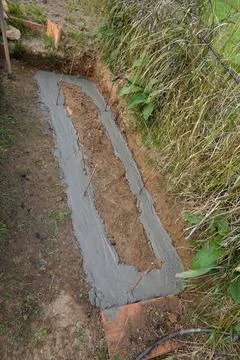Diy garden path foundation construction in progress Stock Photos