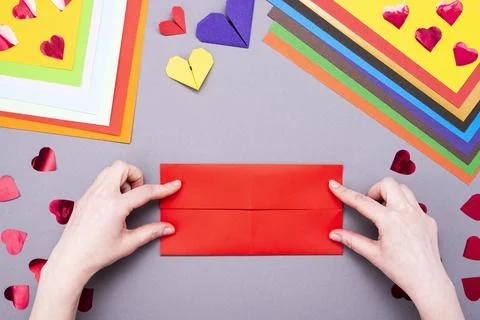 DIY instruction. Step by step guide. The process of making a paper heart with Stock Photos