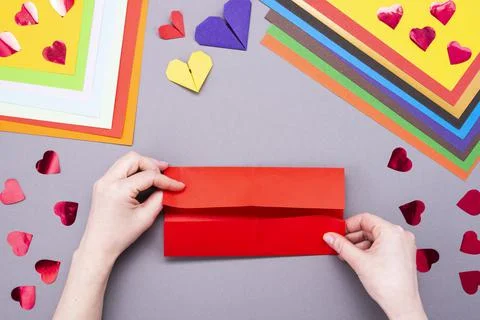 DIY instruction. Step by step guide. The process of making a paper heart with Stock Photos