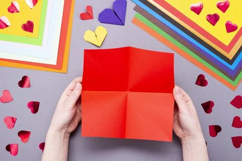 DIY instruction. Step by step guide. The process of making a paper heart with Stock Photos