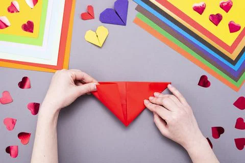 DIY instruction. Step by step guide. The process of making a paper heart with Stock Photos