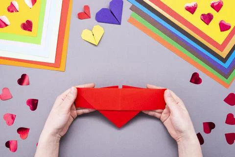 DIY instruction. Step by step guide. The process of making a paper heart with Stock Photos
