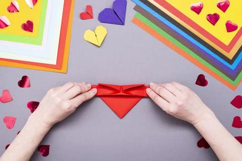 DIY instruction. Step by step guide. The process of making a paper heart with Stock Photos