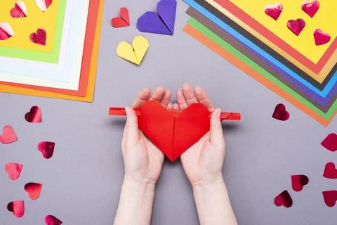 DIY instruction. Step by step guide. The process of making a paper heart with Stock Photos