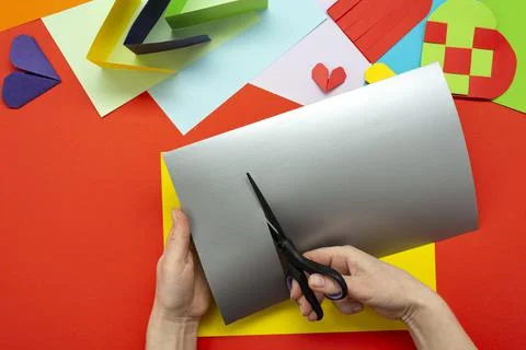 DIY instruction. Step by step guide. The process of making a paper heart from Stock Photos