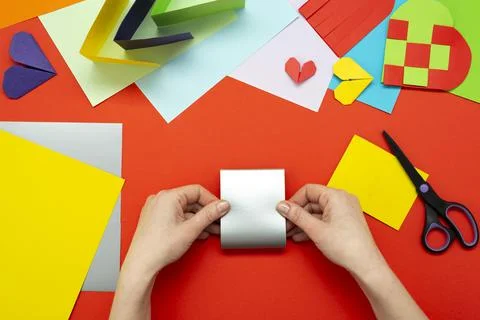 DIY instruction. Step by step guide. The process of making a paper heart from Stock Photos