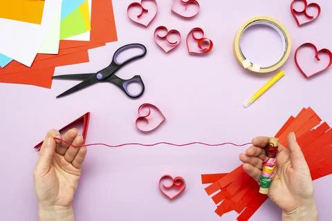 DIY instruction. Step by step guide. The process of making a garland of heart Stock Photos