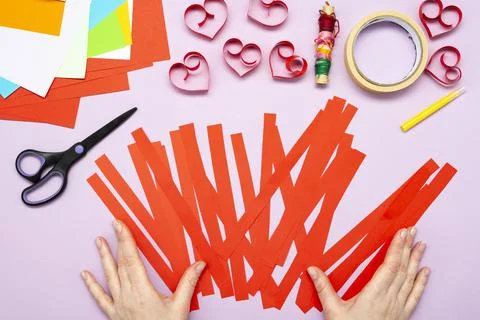 DIY instruction. Step by step guide. The process of making a garland of heart Stock Photos