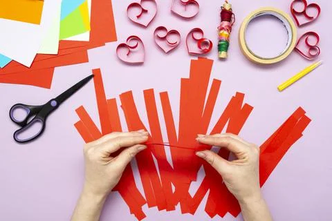 DIY instruction. Step by step guide. The process of making a garland of heart Stock Photos