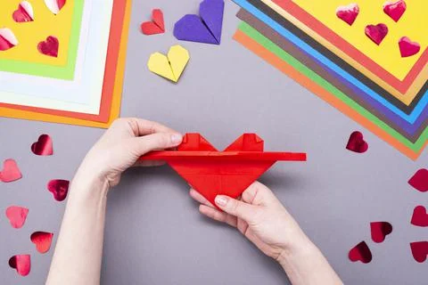 DIY instruction. Step by step guide. The process of making a paper heart with Stock Photos