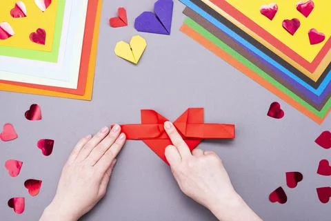 DIY instruction. Step by step guide. The process of making a paper heart with Stock Photos