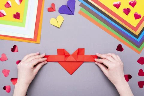 DIY instruction. Step by step guide. The process of making a paper heart with Stock Photos
