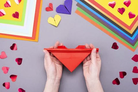 DIY instruction. Step by step guide. The process of making a paper heart with Stock Photos