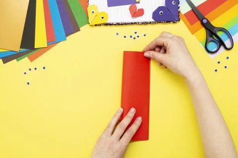 DIY instruction. Step by step guide. The process of making a bookmark for a b Stock Photos