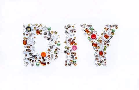 Diy lettering collected from handmade tools such as buttons, ear wires, locks Stock Photos
