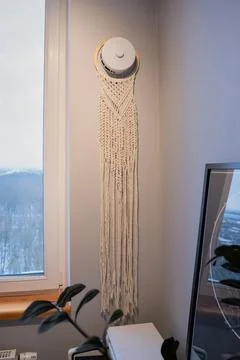 Diy macrame wall decor on supply air valve on wall and window 스톡 사진