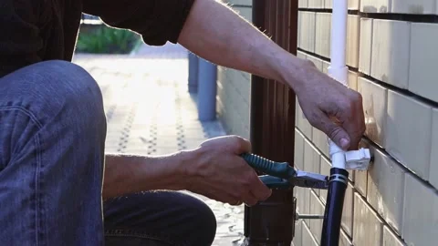 DIY repair and construction. Replacing the water pipe in the house. Stock Footage 154408231