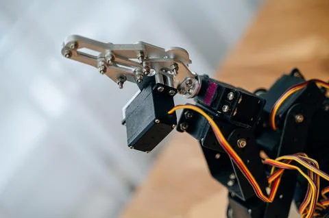 DIY robotic arm with Raspberry Pi and Arduino components. Stock Photos
