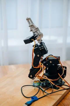 DIY robotic arm with Raspberry Pi and Arduino components. Stock Photos