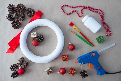 DIY Step 1 top view materials fir cones decorative toys and ribbon for Christmas Stock Photos