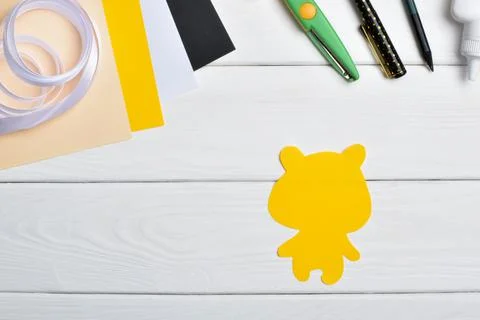 DIY tiger. Step by step. Handmade. Step 1. Cut out the tiger's torso. Flat la Stock Photos