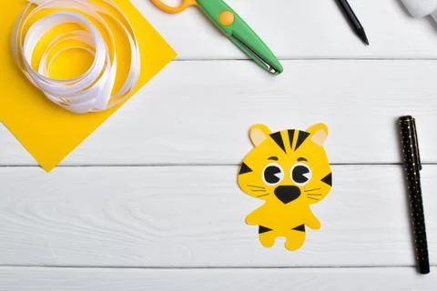 DIY tiger. Step by step. Handmade. Step 5. Draw the tiger's eyebrows and must Stock Photos