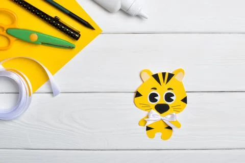 DIY tiger. Step by step. Handmade. Step 6. Glue the satin bow, and the tiger  Stock Photos