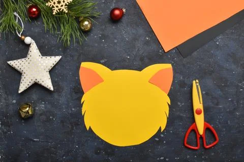 DIY tiger. Step by step. Handmade. Step 3. Glue the ears. Flat lay, top view. Stock Photos