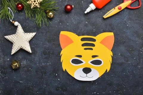 DIY tiger. Step by step. Handmade. Step 7. Cut out the eyes in the tiger mask Stock Photos