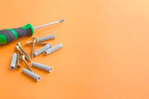 DIY tool set consisting of screws, dowels and screwdriver Stock Photos