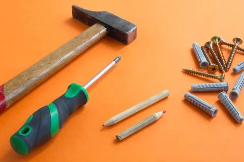 DIY tool set consisting of screws, dowels, screwdriver and hammer Stock Photos