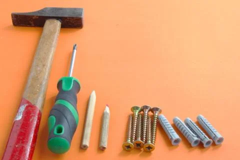 DIY tool set consisting of screws, dowels, screwdriver and hammer Stock Photos