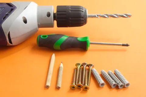 DIY tool set consisting of screws, dowels, screwdriver and drill Stock Photos