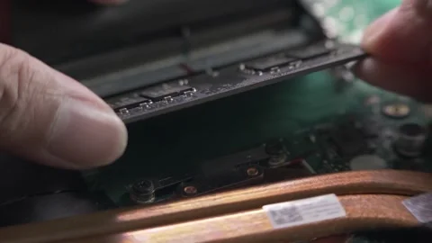 DIY upgrading laptop memory at home close up, shallow DOF 60p Stock Footage 141243897