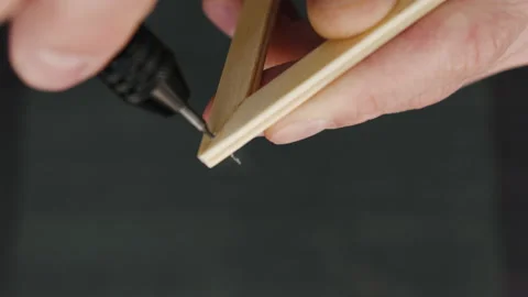 DIY Using a Hand Drill to Make a Wooden Structure from Ice Cream Sticks Stock Footage 238668830