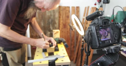 DIY woodworking vlog, drawing marking lines on wood block, filming Stock Footage 154806581