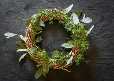 DIY wreath made from eucalyptus and fir tree decoration. Stock Photos