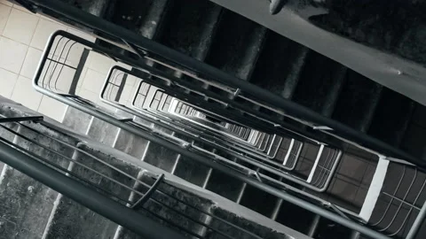 The dizzying flight of the camera in the space of the stairwell. Stock Footage 157273494