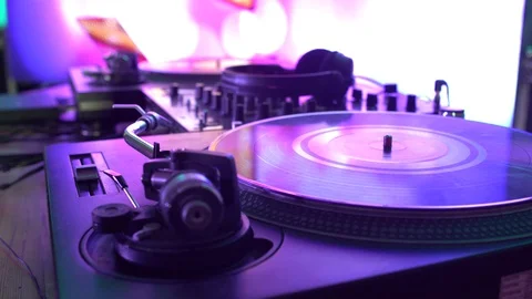 DJ actively controls the remote during a nightclub party, youth dancing Video stock 129359203