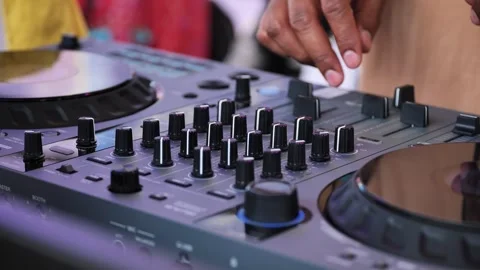 Dj adjusting knobs on mixer in India 스톡 동영상 316174208