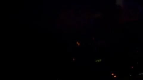 DJ adjusts music on the remote Stock Footage 81784000