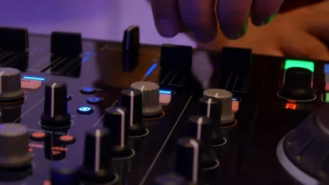 DJ adjusts the remote Stock Footage 92691689