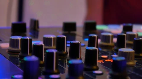 DJ adjusts the remote Stock Footage 92720659