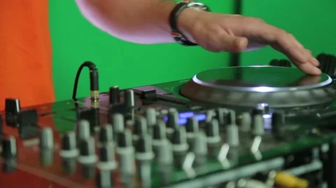 Dj adjusts the tempo on the mixing panel Stock Footage 61220569